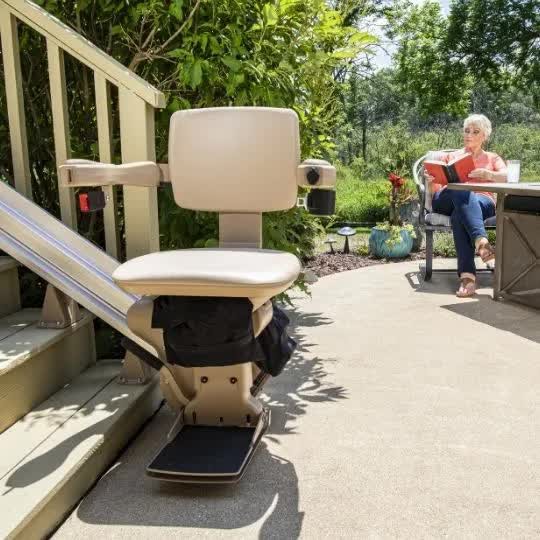Bruno Elite outdoor stairlift installed on wooden porch steps